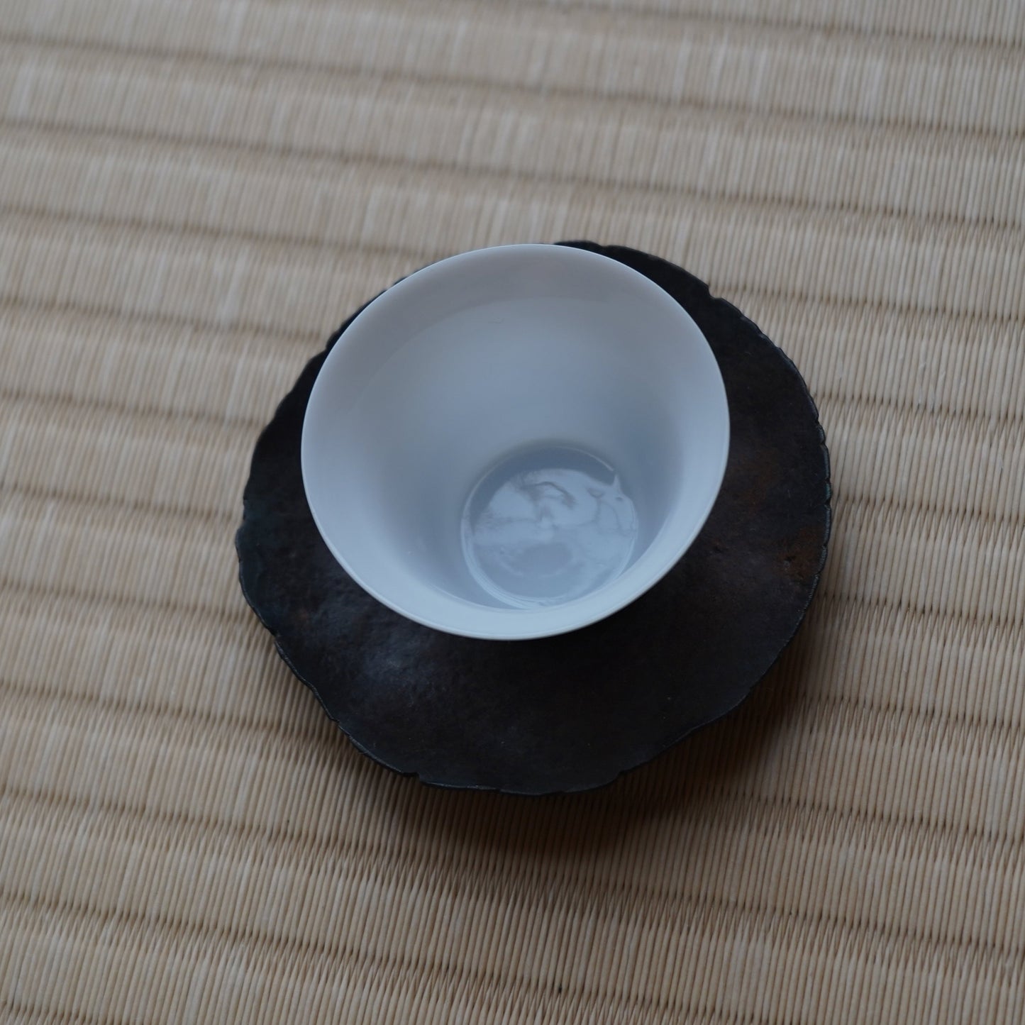 Hand-forged iron tea saucer